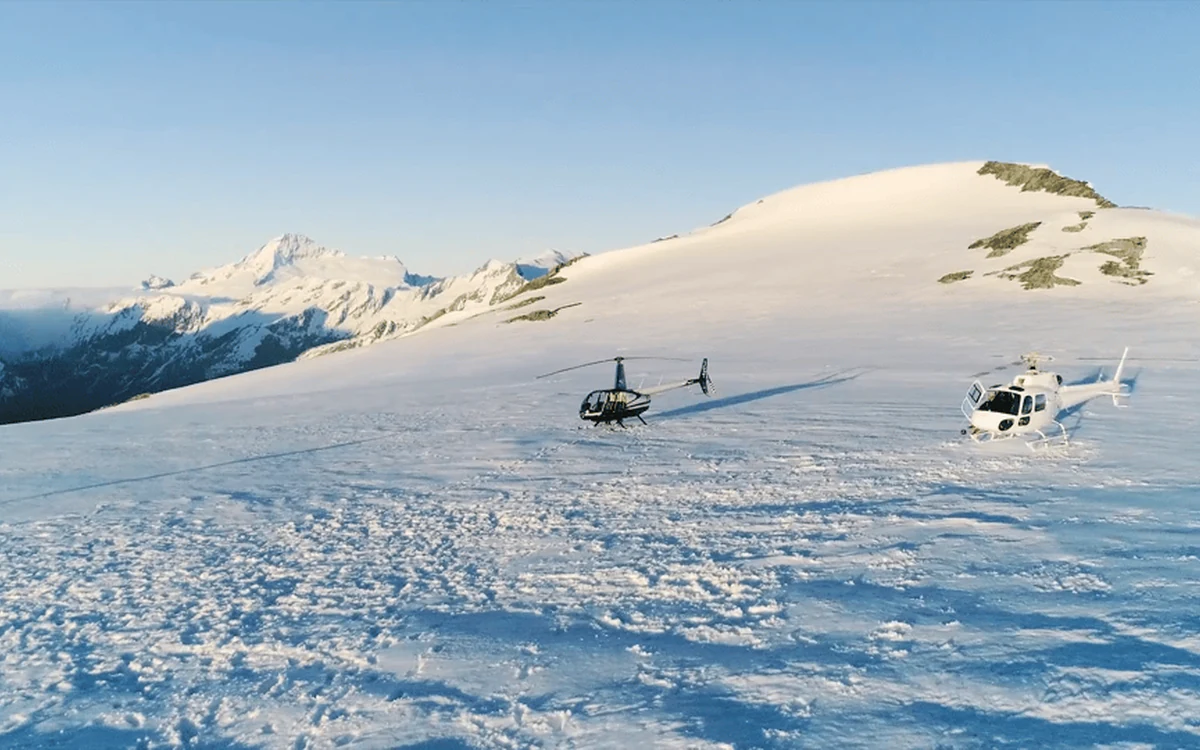 A helicopter on a snow landing site high in the Southern Alps above Wanaka