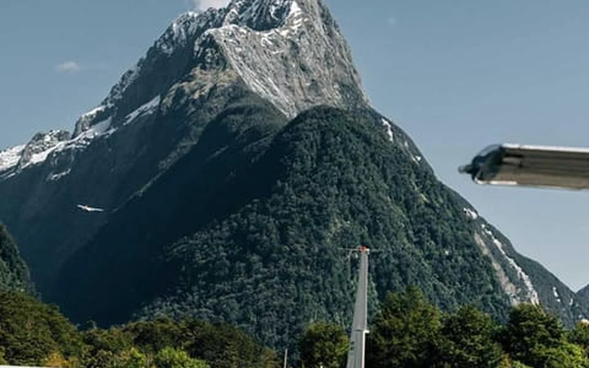 Mitre Peak rising above the still water of Milford Sound