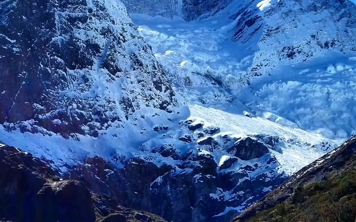 Walkers on the Rob Roy Glacier hike near Wanaka with the alpine valley opening out ahead